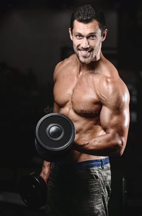 Man With Weight Training In Gym Equipment Sport Club Stock Photo