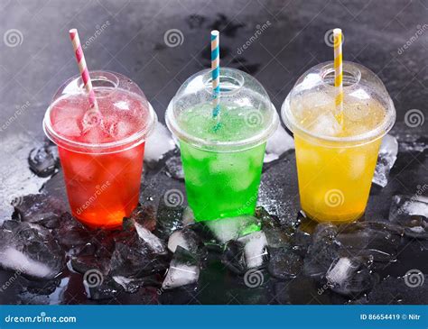 Colorful Cold Drinks In Plastic Cups With Ice Stock Image Image Of