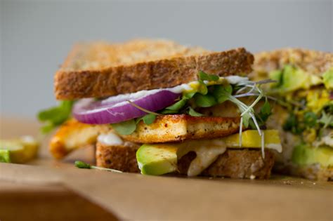 Vegan Lunch Sandwich With Sizzling Skillet Tofu Avocado And Sprouts