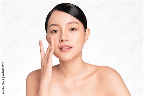 Beautiful Young Asian Woman With Clean Fresh Skin On White Background