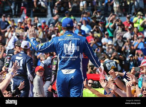 Nascar Driver Dale Earnhardt Jr Waves To The Crowd During Driver