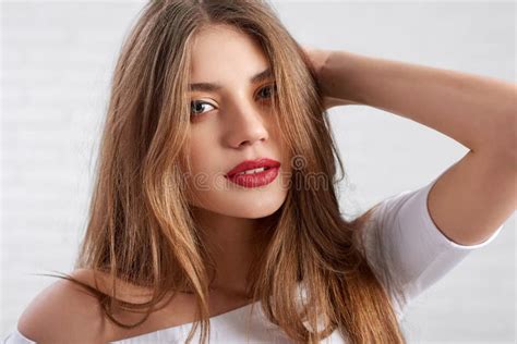 Attractive Caucasian Female Model In White Top Wearing Eye Make Up And