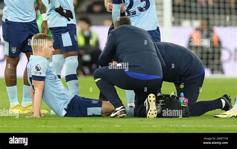 Ben Mee Of Brentford Receives Medical Treatment Before Being