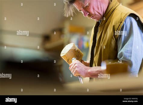 Mature Man Using Mallet Chisel Hi Res Stock Photography And Images Alamy