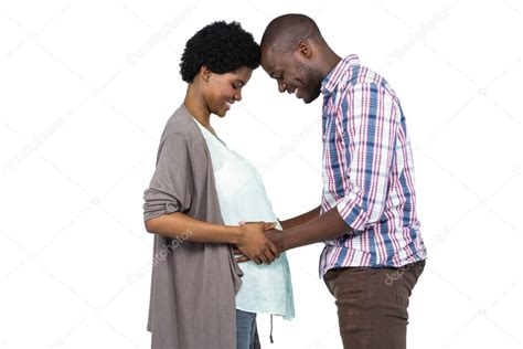 Man Touching Pregnant Womans Stomach Stock Photo Wavebreakmedia