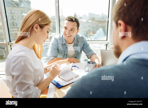 Attentive Blonde Woman Checking Her Timetable Stock Photo Alamy