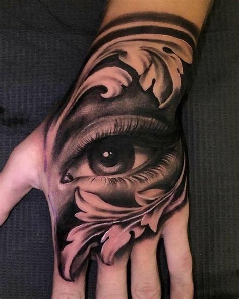 A Person S Hand With An Eye And Flower Tattoo On The Left Palm