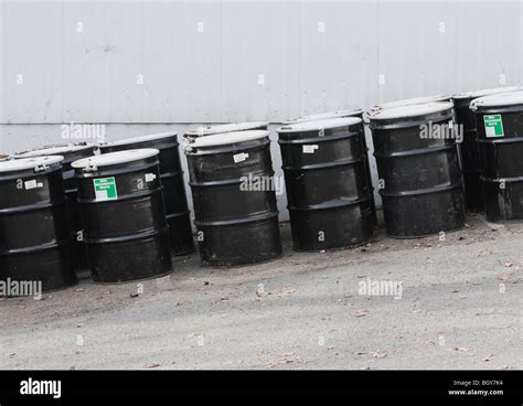 Row Of Black Barrels Stock Photo Alamy