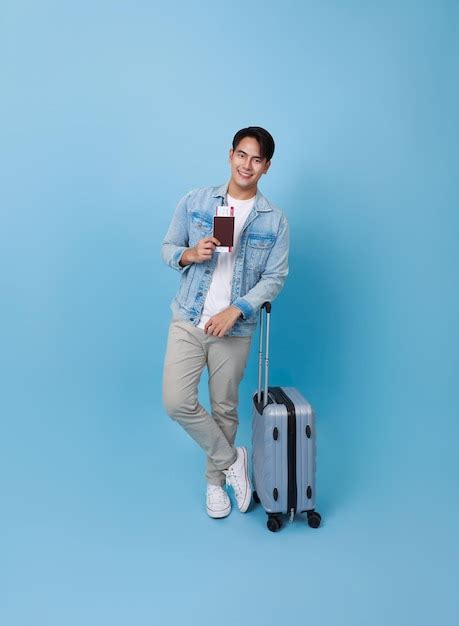 Premium Photo Happy Smiling Young Asian Tourist Man Holding Passport