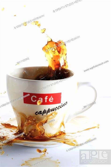 Cup Of Splashing Coffee Splash Stock Photo Picture And Royalty Free