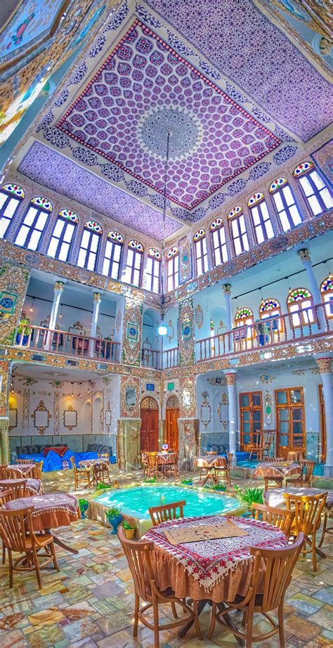 An Ornately Decorated Room With Tables And Chairs