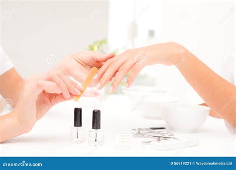 Beautician Filing Female Clients Nails At Spa Beauty Salon Stock Image