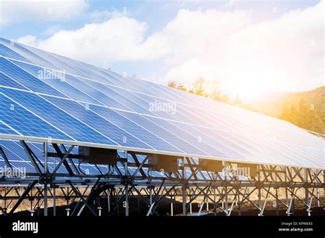 Solar Panels Under Blue Sky On Sunset Stock Photo Alamy