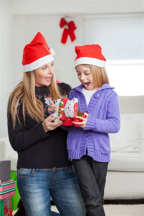 Surprised Mother And Daughter With Christmas T Stock Image Image