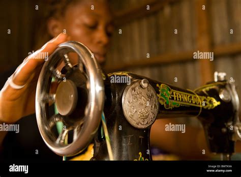 Girl Sewing In Tailor S Shop Freetown Sierra Leone West Africa Stock