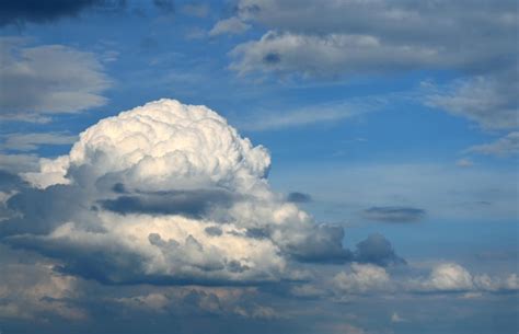 Premium Photo Fluffy Cumulus Clouds On Blue Sky