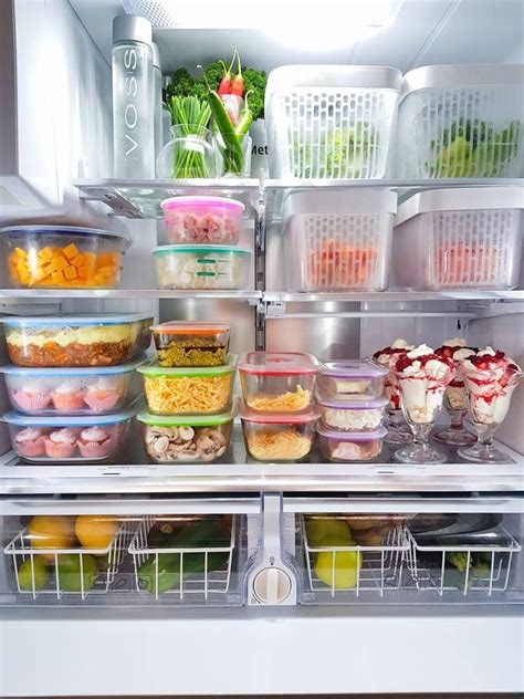 An Open Refrigerator Filled With Lots Of Food