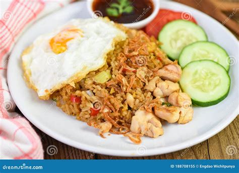 Nasi Goreng Fried Rice Chicken With Egg Tomato Cucumber On White Plate