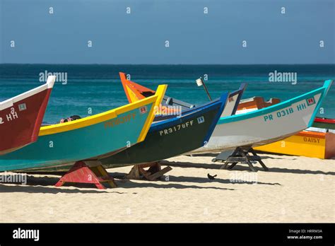 ROW OF BRIGHTLY PAINTED YOLA FISHING BOATS CRASH BOAT BEACH AGUADILLA