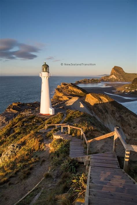 castlepoint lighthouse, lagoon and castle rock in golden sunrise light ...