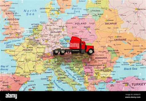 Red truck on the Europe map Stock Photo - Alamy