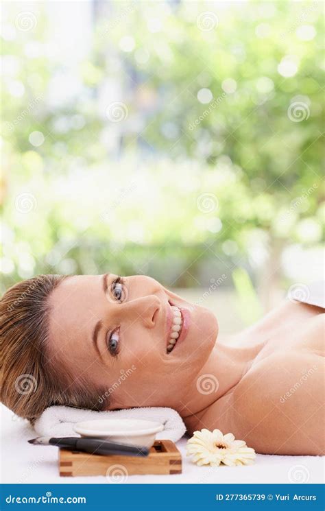 Spending A Day At The Health Spa A Woman In A Day Spa Relaxing On A Massage Table Stock Image