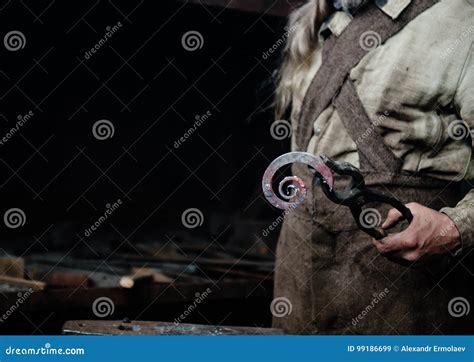 The Hands Of A Blacksmith Holding Forged Product Stock Image Image Of
