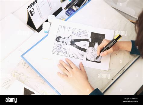 Japanese Manga artist working in the studio Stock Photo - Alamy