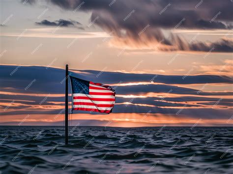 Premium Ai Image American Flag On The Sea At Sunset Or Sunrise