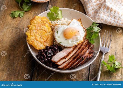 Caribbean Or Latin American Breakfast With Rice Beans And Pork Stock