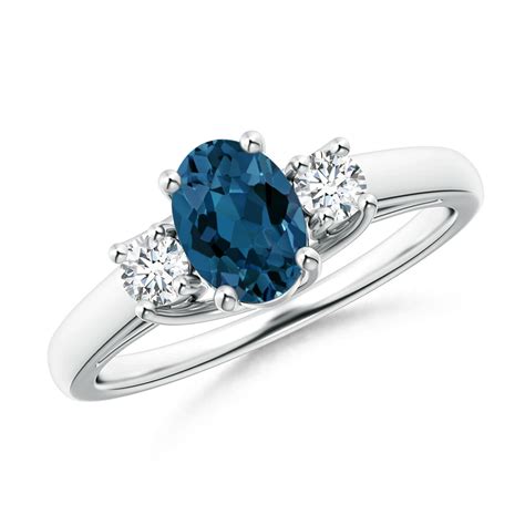 Oval London Blue Topaz And Round Diamond Three Stone Ring Angara