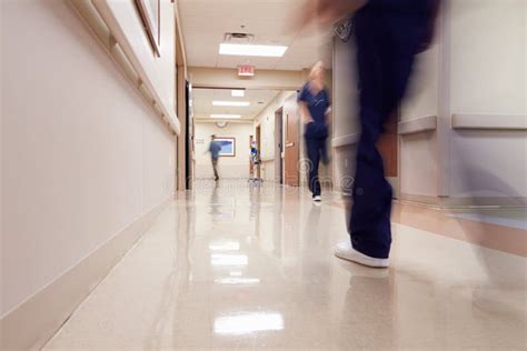 Busy Hospital Corridor With Medical Staff Stock Image Image Of Scrubs