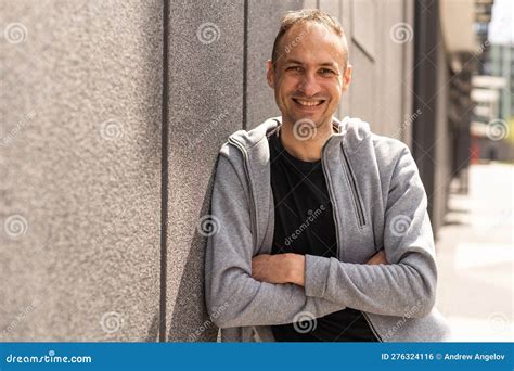 Successful Caucasian Middle Aged Man In Casual Outfit With Arms Crossed