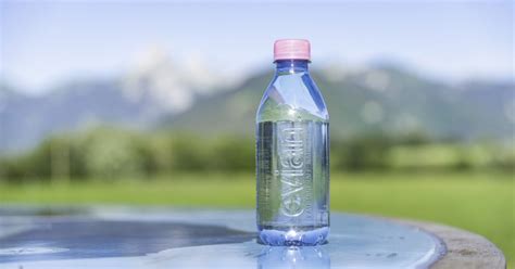 Evian Natural Mineral Water Bottles Now Have A Pink Bottle Cap And 100