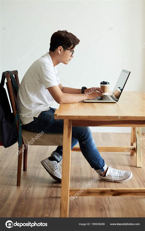 Side View Vietnamese College Student Sitting Table Working Laptop Stock