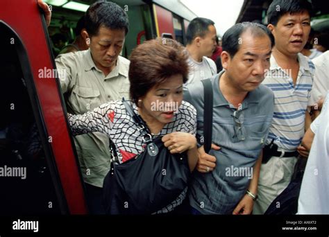 Chinese Commuters Disembark From A Kcr Train At The Lo Wu Border