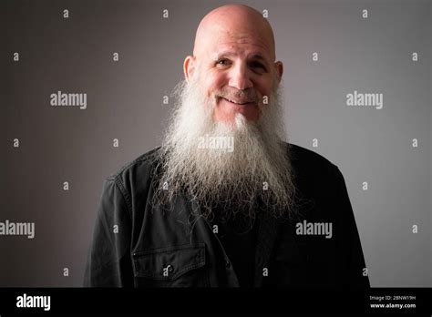 Face Of Happy Mature Handsome Bald Man With Long Beard Smiling Stock