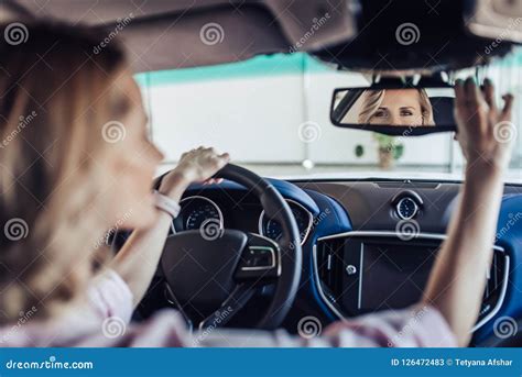 Woman Adjusting The Rear View Mirror In Car Stock Image Image Of