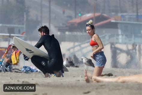 Miley Cyrus Sexy In A Cheeky Red Bikini With Boyfriend Liam Hemsworth In Malibu AZNude