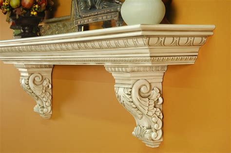 A heavy, large mantel shelf with solid wood acanthus leaf corbels