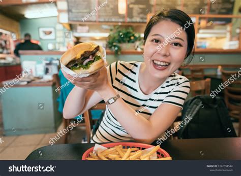 Woman Eating Fast Food Beef Burger Stock Photo 1242594544 Shutterstock