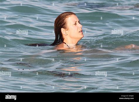 Kate Walsh Shows Off Her Figure Wearing A Black Bikini As She Spends