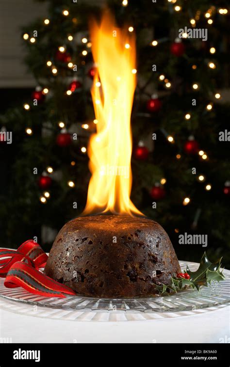 christmas pudding with large flame Stock Photo - Alamy