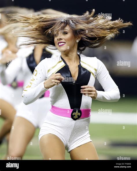 A New Orleans Saints Cheerleader Entertains The Crowd During A Break In