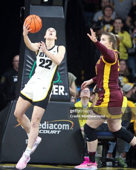 Guard Caitlin Clark of the Iowa Hawkeyes goes to the basket in the ...