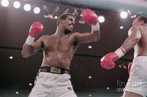 Michael Spinks Boxing Against Larry Photograph by Bettmann - Fine Art ...