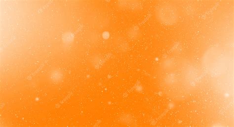 Premium Photo Snow Flake Particles On Orange Background