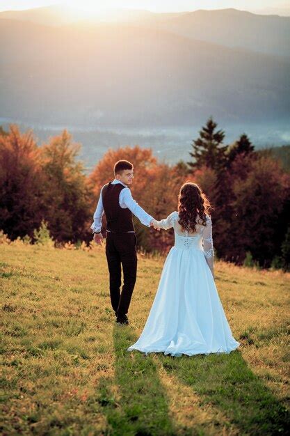 Premium Photo Bride And Groom At Sunset Romantic Married Couple