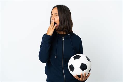 Premium Photo Young Football Player Woman Isolated On White Yawning