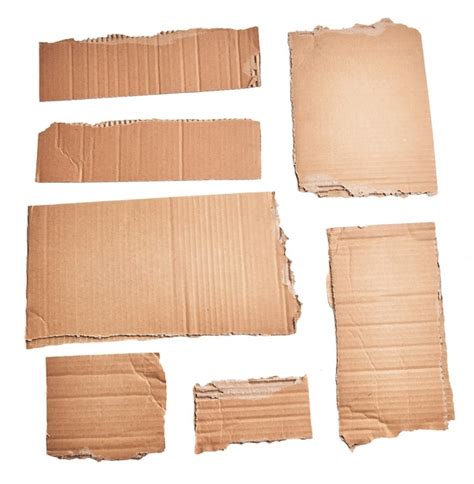 Premium Photo Ripped Pieces Of Cardboard Material Over Isolated White